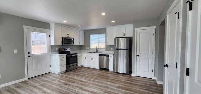 Building Photo - MOVE IN SPECIAL! New Construction Duplex i...