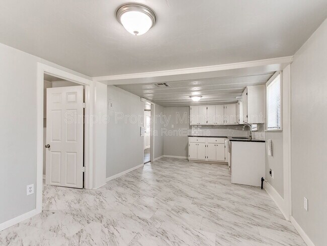 Building Photo - 9706 N Garnett Dr