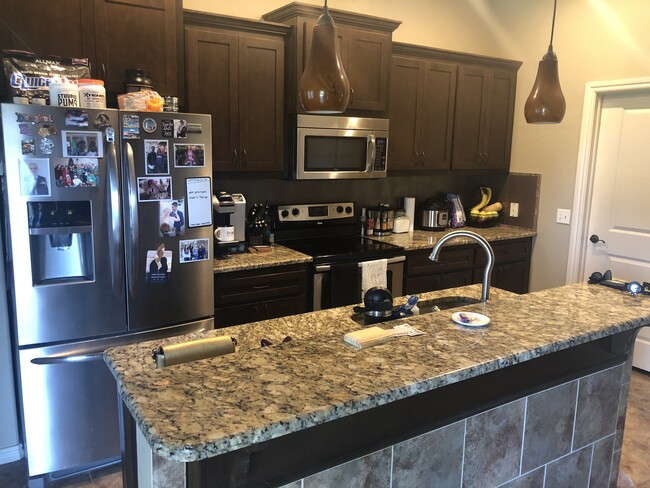 Plenty of cabinet space - bottom cabinets feature pullout drawers for easy storage. Full pantry. - 2327 Austrian Pine Dr