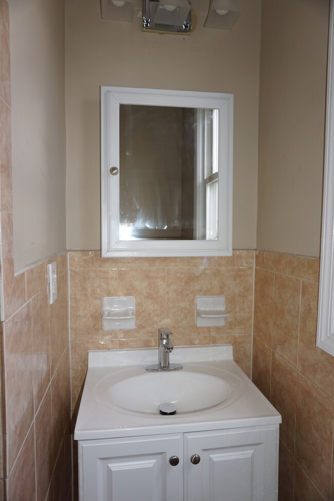 Bathroom sink and vanity - 957 Grove St