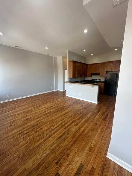 Large living/dining room with REAL hardwood floors recently refinished - 1426 Madison Ave