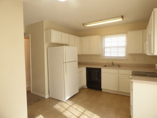 Building Photo - COMING SOON! Spacious Townhouse, W/D Hookups, Off-Street Parking, All Electric!
