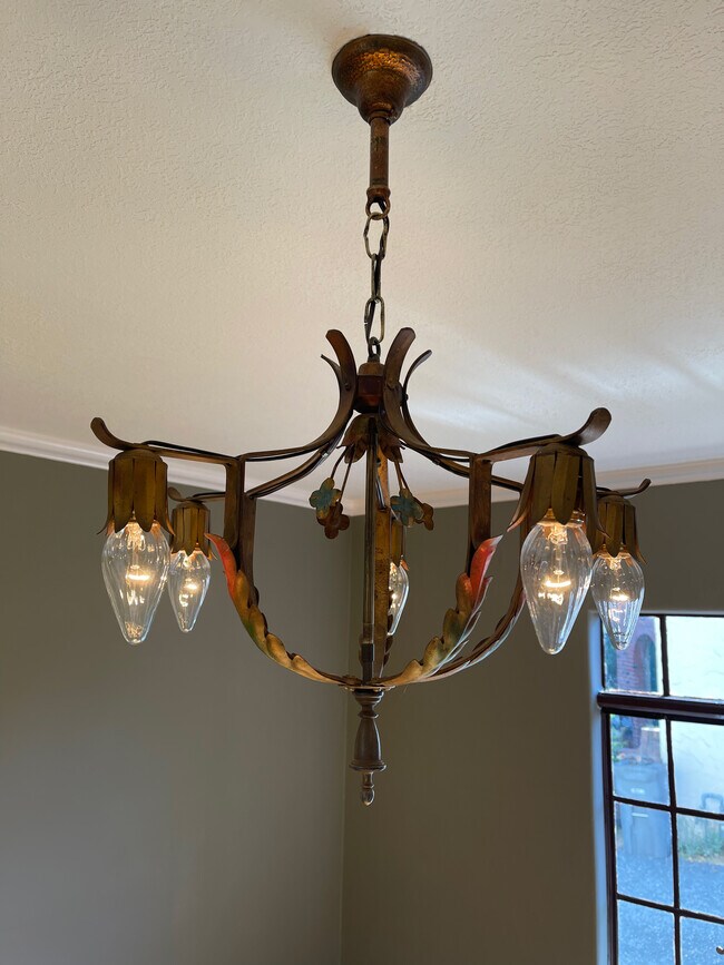 Period chandelier and original wall sconces in bedroom. - 517 Benton St