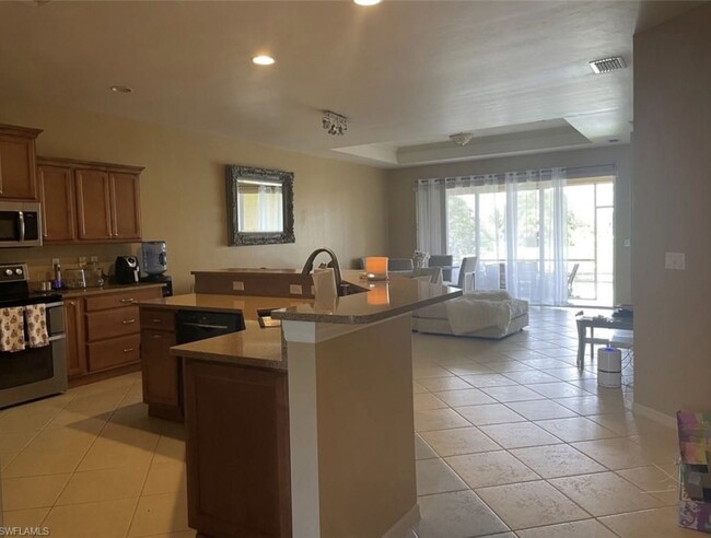 Kitchen opens to livingroom / dining - 627 SW 47th Ter