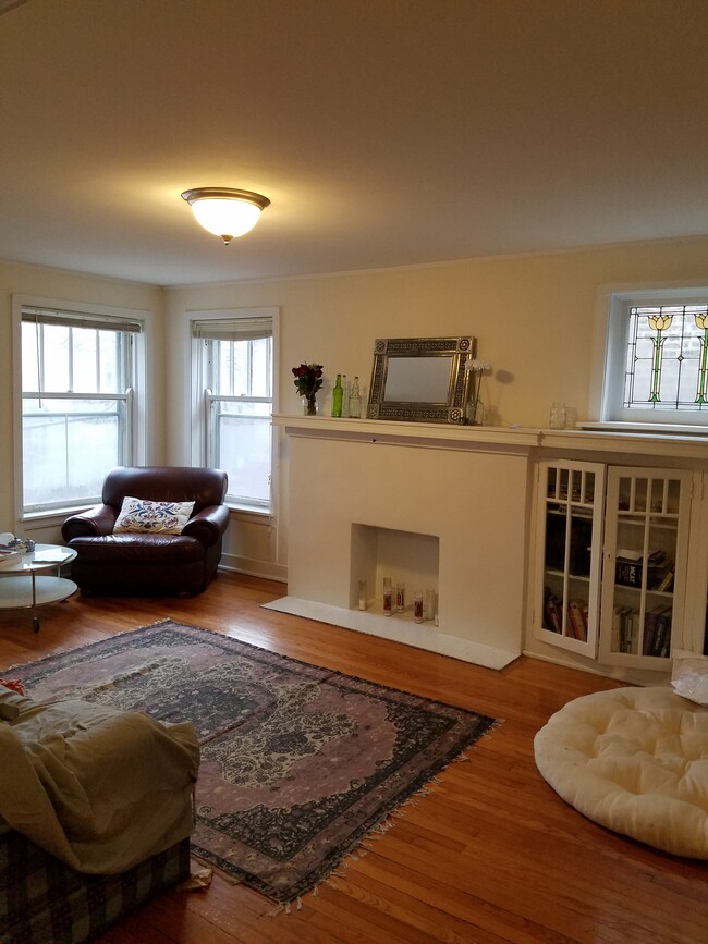 Built-in faux fireplace with book case - 1256 W Arthur Ave