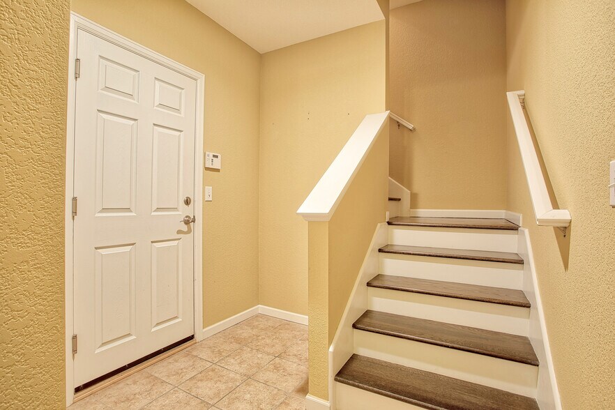 Basement mud room located off garage - 7422 E 7th Ave Unit 14