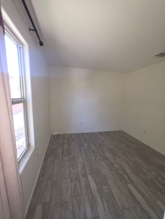 Building Photo - COMING SOON! New 3BR 2 BA Home w/ 2-Car Garage • Stainless Kitchen • Timer-Irrigated Yard in East...