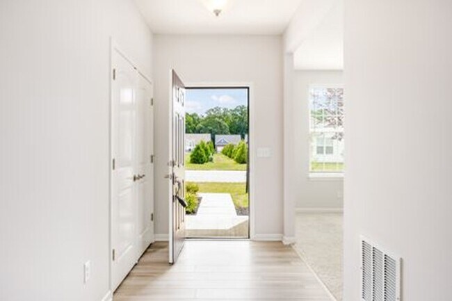 Building Photo - Updated 3-Bedroom Home with 3 Baths, Open-Concept Layout, Luxury Flooring & Bright Modern Kitchen