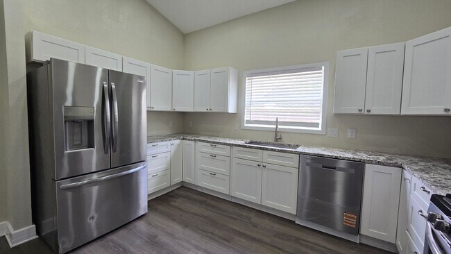 Building Photo - Spacious Ranch Style 5-Bedroom Home with Oversized 4 Car Garage / Workshop, 4 RV Carport & 1 Acre...