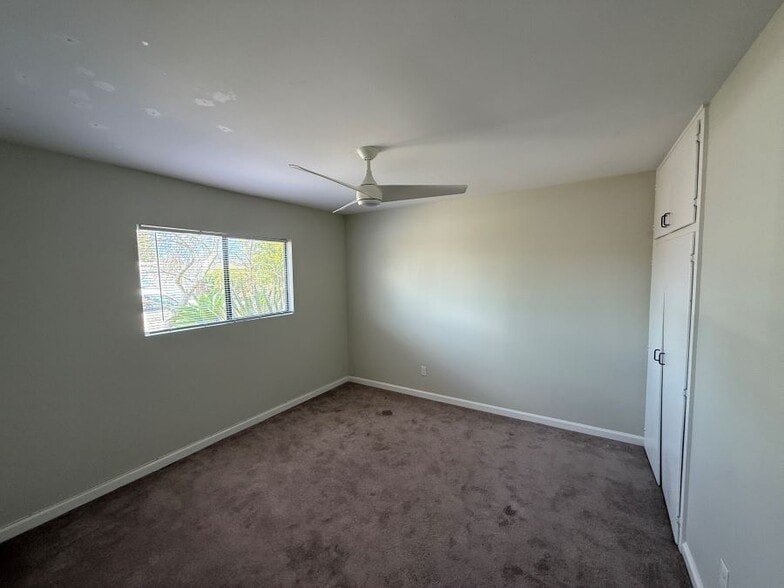 2nd bedroom facing street with ceiling fan - 3112 Idlewild Way