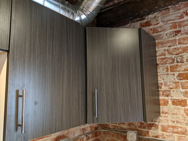 Custom made cabinets throughout apartment. - 130 E State St