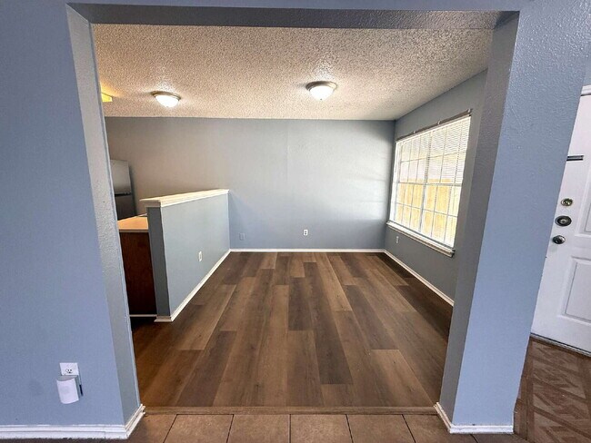 Building Photo - Move-In Ready 3BR/2BA: Updated Kitchen, New Light Fixtures & Fenced Yard