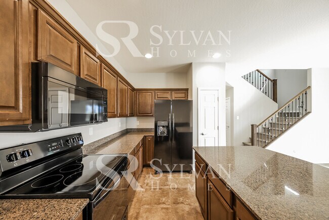 Building Photo - This home exudes a cheerful and welcoming charm!