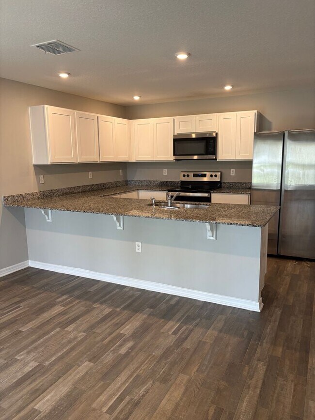 Building Photo - Beautiful 4-Bedroom Corner-Lot Home in Poinciana with 2-Car Garage