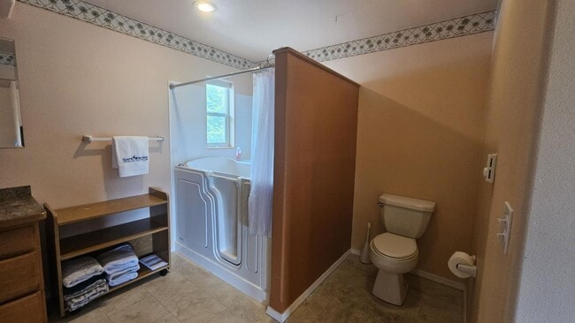 Building Photo - Out of town house with double garage and l...