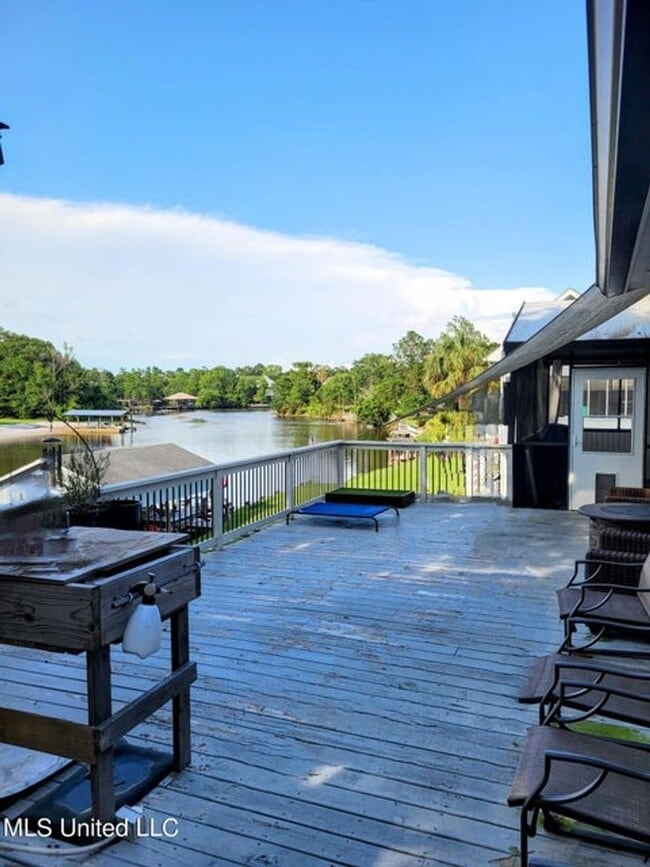 Building Photo - Riverfront Living with Private Boat Launch