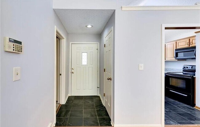 Building Photo - COMING SOON: Charming 2-Bedroom Condo in a...