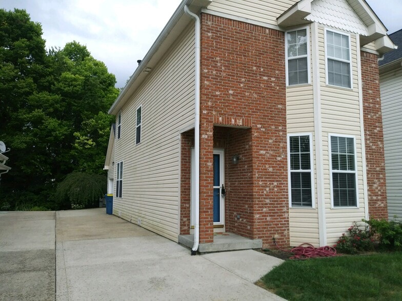 Concrete drive to the 2 car garage and back patio. - 231 Legacy Lane