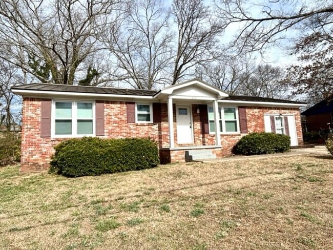 Building Photo - FOUR BEDROOM ONE AND HALF BATH BRICK RANCH HOME
