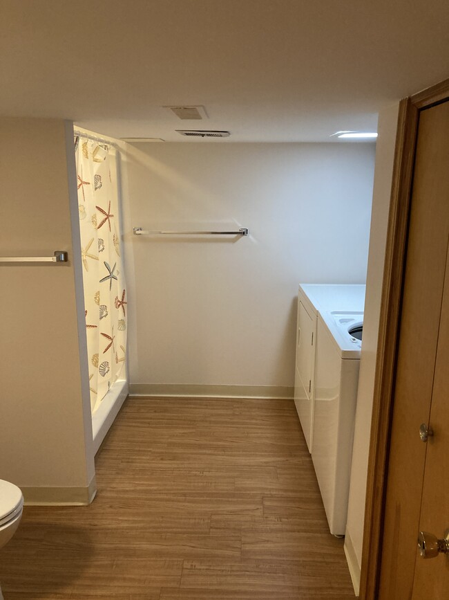 Bathroom with washer and dryer - 7065 Starcliff Ave NW