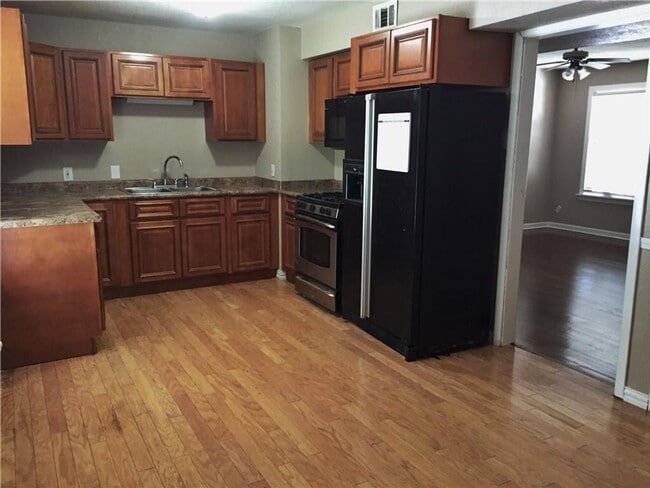 Building Photo - Remodeled 1 story home in Hurst with original plank wood flooring