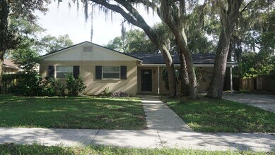 Building Photo - Four Bed - Three Bath - Large Storage Area...
