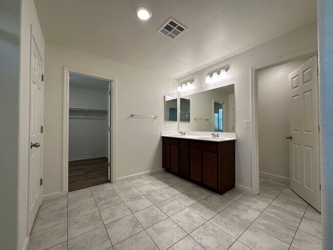 Building Photo - Stunning 4 Bedroom, 3 Bath Gated Community W/ Solar
