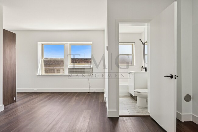 Building Photo - Sleek, Bright & Brand New — Stylish Studio...