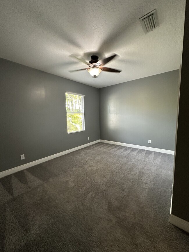 Building Photo - Spacious 4-Bedroom Home in Melbourne, FL w...