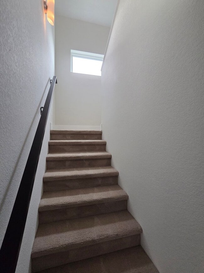 Building Photo - STUNNING 4-LEVEL TOWNHOME IN HIGHLANDS WITH SAUNA, 2-CAR GARAGE + AMAZING ROOFTOP DECK!