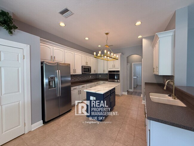 Building Photo - Executive Home with Custom Finishes in Gat...