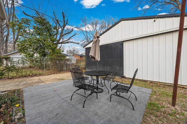 Building Photo - Classic Brick Ranch with 24x24 Workshop, Fenced Yard & Garden Beds