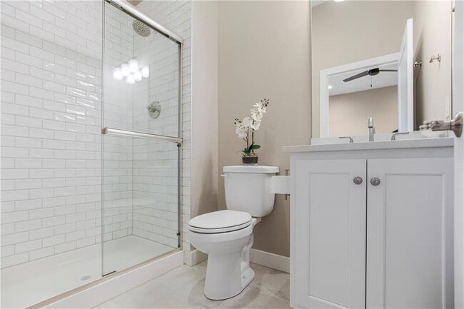 Master bath with tiled shower - 11030 W 55th Ter
