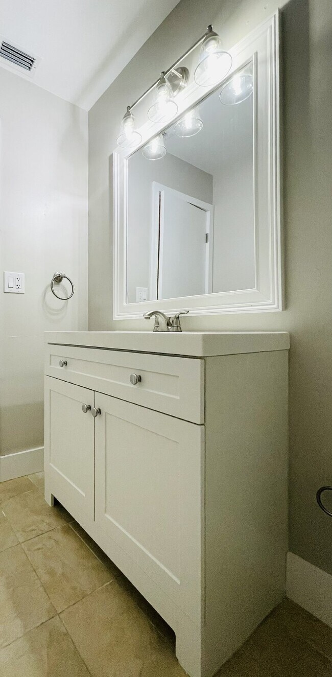 Building Photo - Updated 2-bedroom waterfront duplex with walk-in closets, enclosed Florida room, and canal views ...