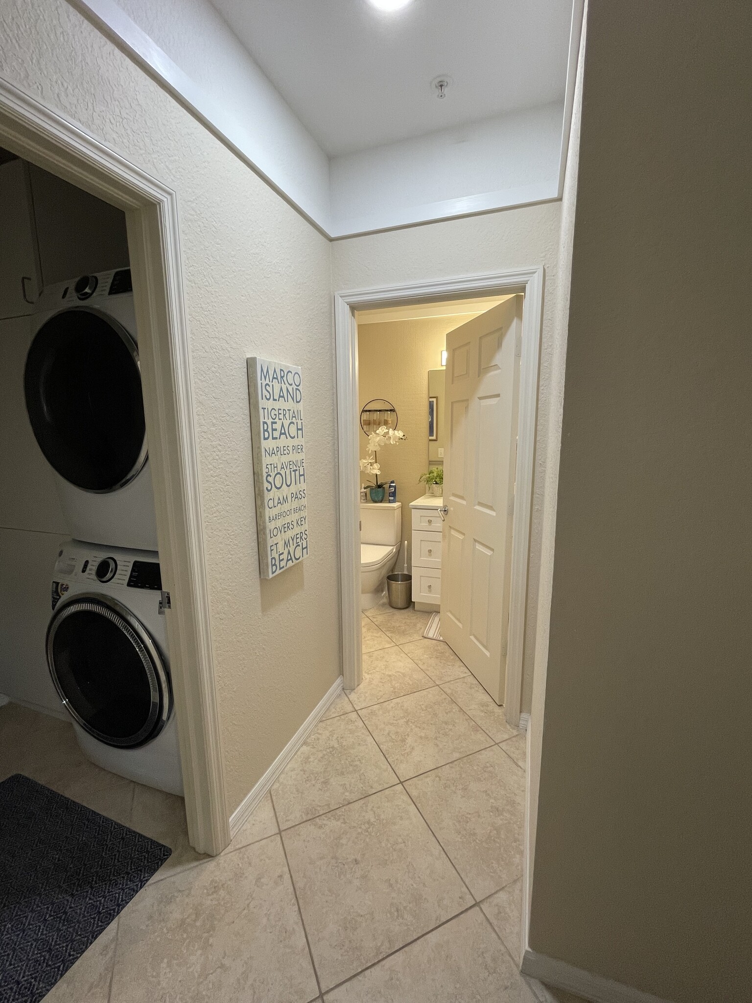 Hallway to laundry room, guest bedroom and guest bathroom - 3235 Cypress Glen Way