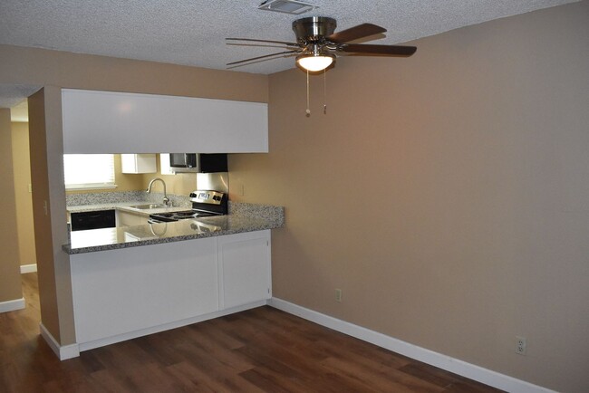 Building Photo - Condo unit featuring updated kitchen with ...