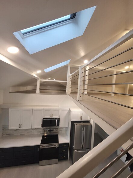 View from stairs looking onto kitchen - 133 E Reed St
