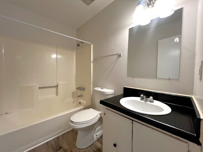 Building Photo - Updated 2BR, 1BA Apartment Off Old Palafox Hwy with LVP Flooring Throughout, Vaulted Ceilings & W...