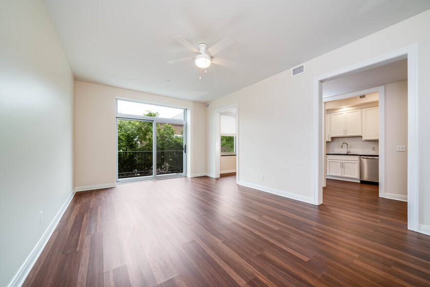 201 living room w/slider door to balcony - Peregrine Square