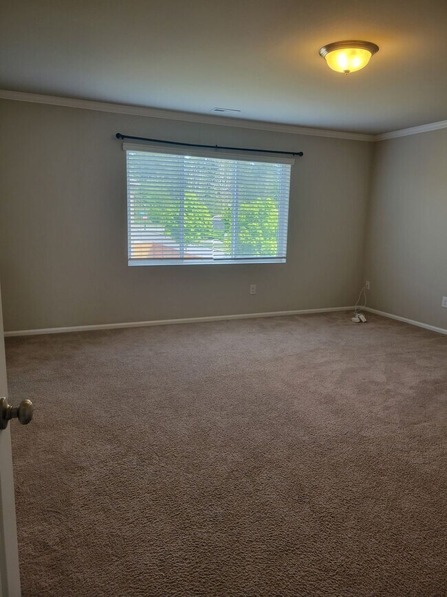 Building Photo - 3 bedroom home with 3 car garage on corner...