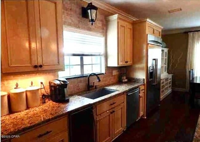 Building Photo - WATERFRONT W/BOAT SLIP!!!! This beautiful home is located in a gated community on North Lagoon Dr...