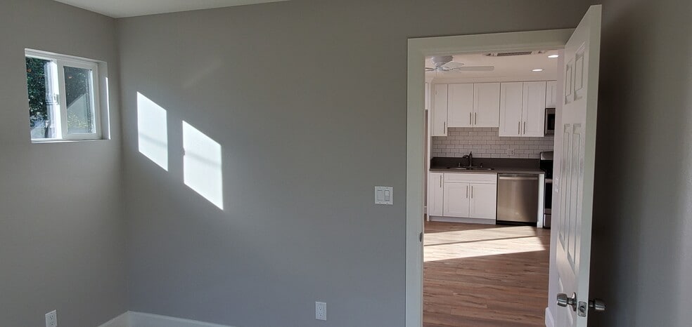 Looking out the bedroom towards living space and kitchen - 7650 Ostrom Ave