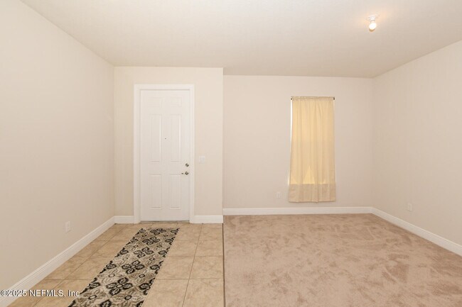 Building Photo - 10976 SW Tessili Wy
