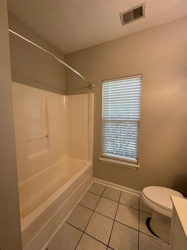 Building Photo - This 1.5  story, all brick, 3 bedroom, 2 bath, Bonus room upstairs & a 2 car garage with great st...