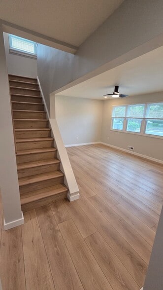 Stairway leading to the second story - 604 Holly Ln