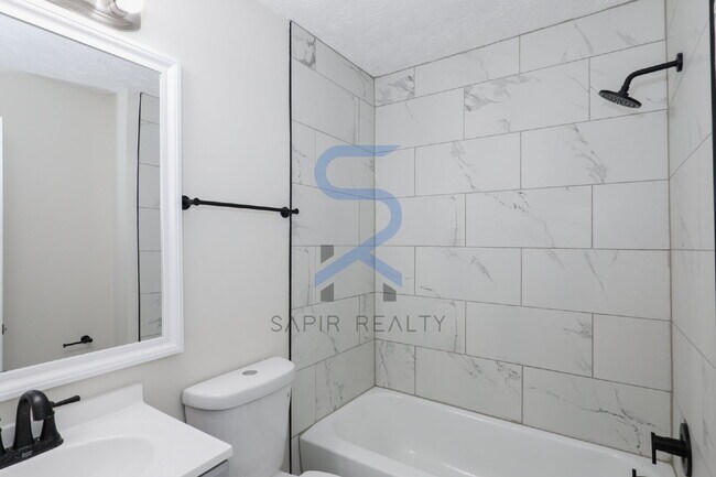 Building Photo - Move in before December 31st and choose your reward: a $250 Amazon Gift Card or a 55" Smart TV!