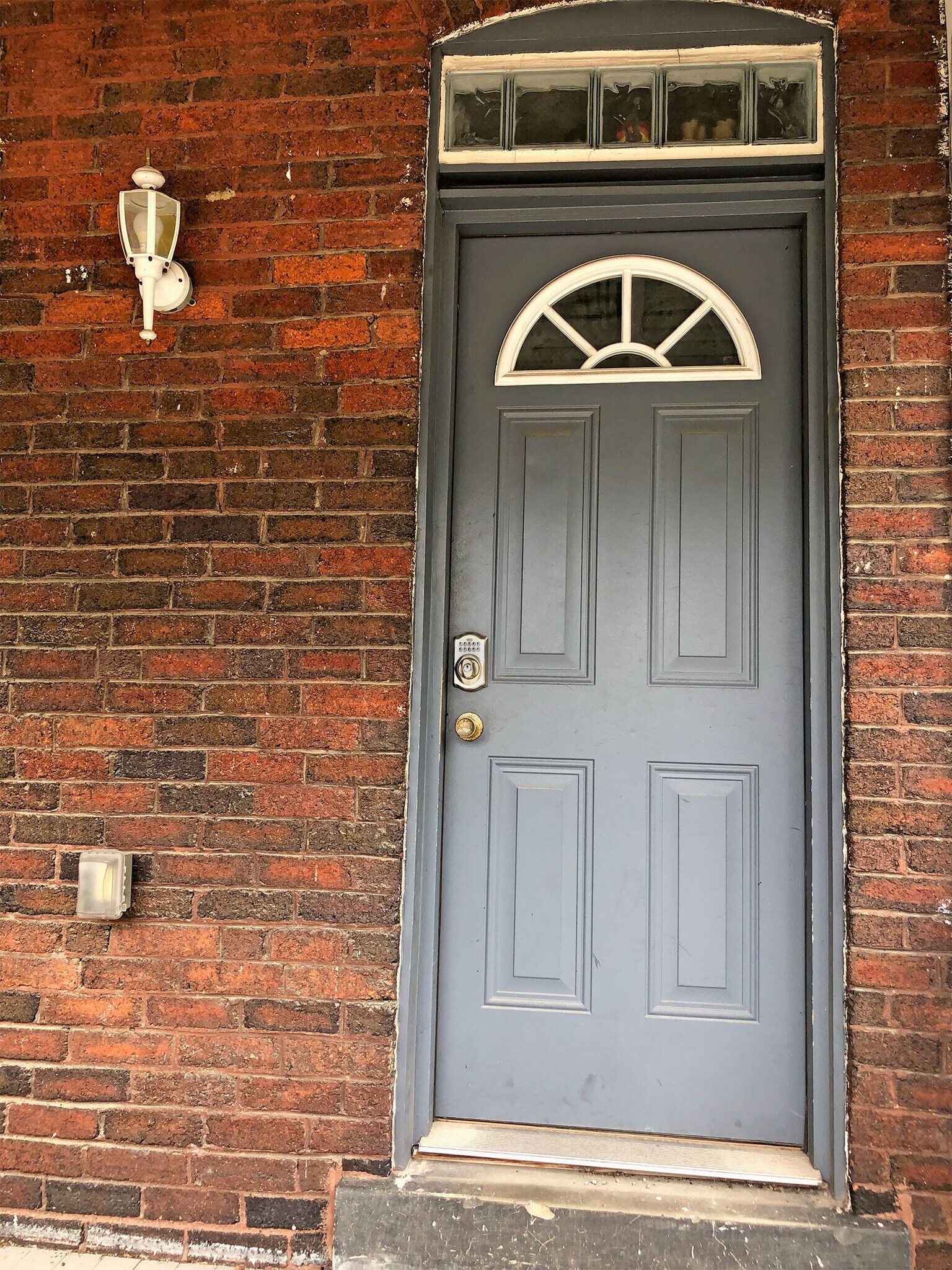 View from parking lot of the rear entry door into the kitchen - 372 E Oakland Ave