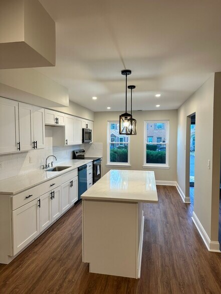 Bright, modern kitchen with brand-new stainless steel appliances, - 55 Providence Ave