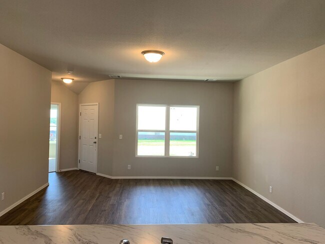Building Photo - This well-designed 4-bedroom home has a split floor plan that gives the feeling of space.
