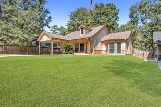 Building Photo - Live just steps from Lake Conroe in this beautifully maintained 3-bedroom, 2-bath home located in...